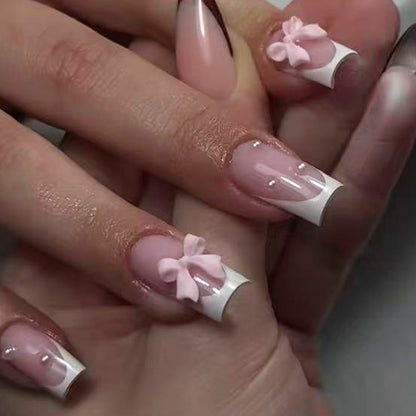 Kunstnagelset mit verspielten Schleifendesigns und eleganten Akzenten Brehn