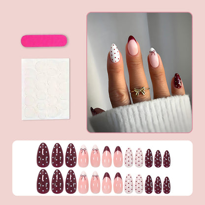 Kunstnagelset mit eleganten Schleifen- und Punktemotiven Brehn