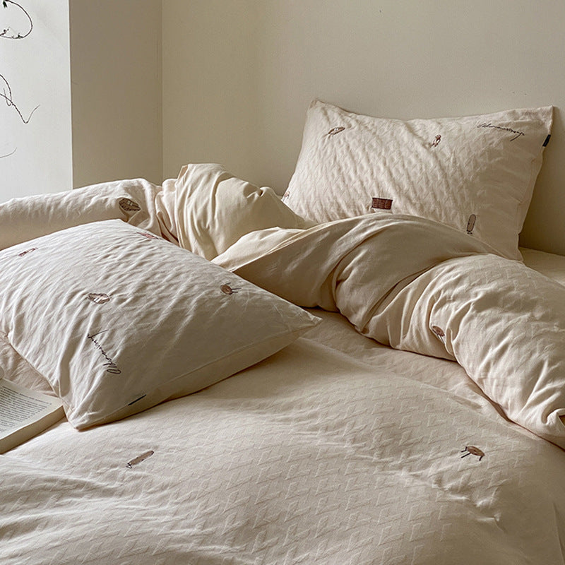 Gesteppte Bettgarnitur aus Bio-Baumwolle mit dezent bestickten Mini-Motiven