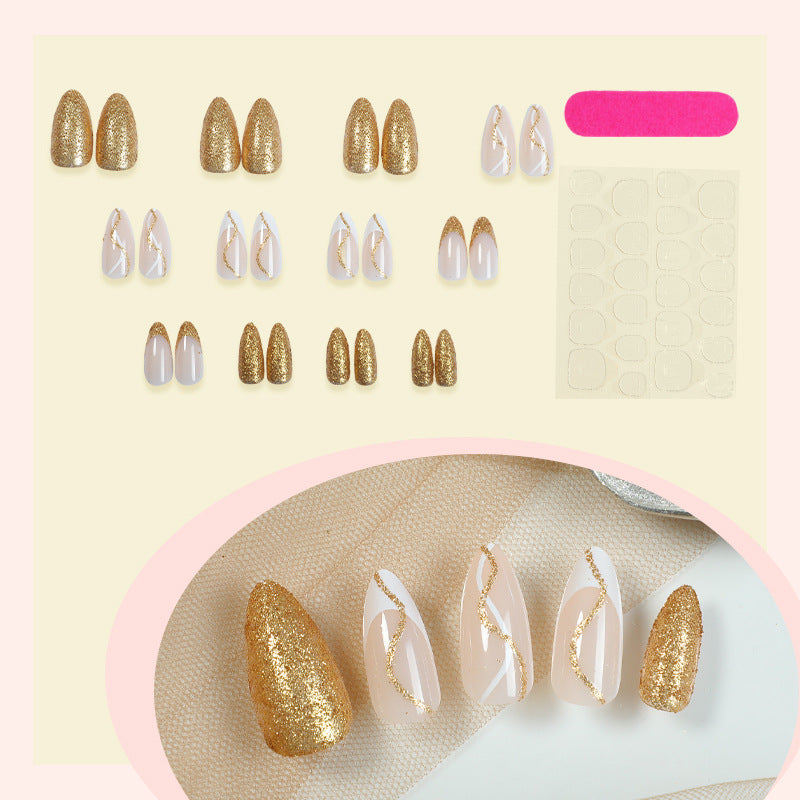 Elegantes Press-On-Nail-Set mit Glitzer und goldenen Wirbelakzenten Brehn