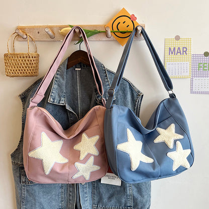 Lässige mit Sternen verzierte Schultertasche