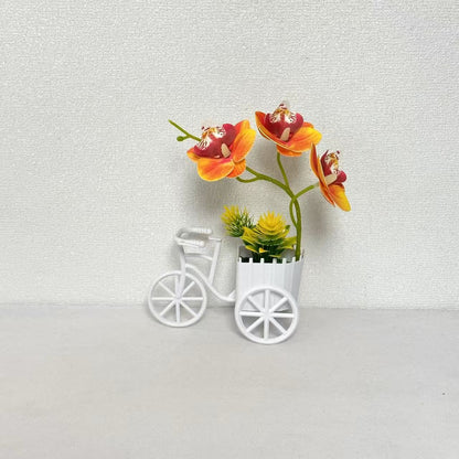 Dekorativer Fahrrad-Blumentopf mit Kunstorchideen-Arrangements für Dekor