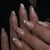 Kunstnagelset mit schimmernden Spitzen und eleganten Schleifen Brehn