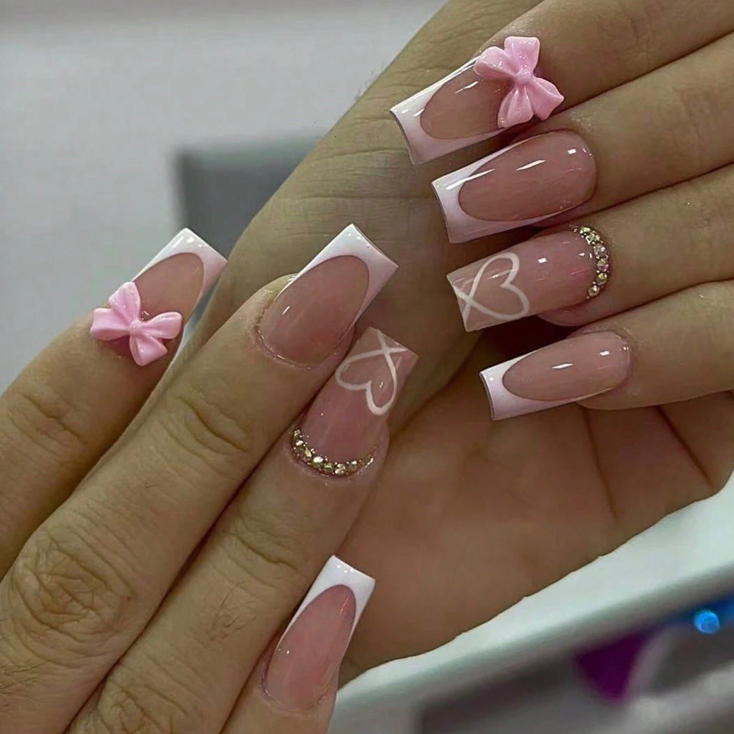 Kunstnagelset mit eleganten Schleifen- und Glitzerverzierungen Brehn