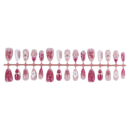 Kunstnagelset mit floralem Design und Glitzerakzenten Brehn