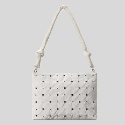 Dekorativer gesteppter Handtasche