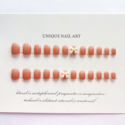 Einzigartiges Press-On Nail Art Set mit dekorativen Schleifen