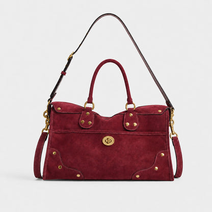Elegante Wildlederhandtasche mit Messingakzenten