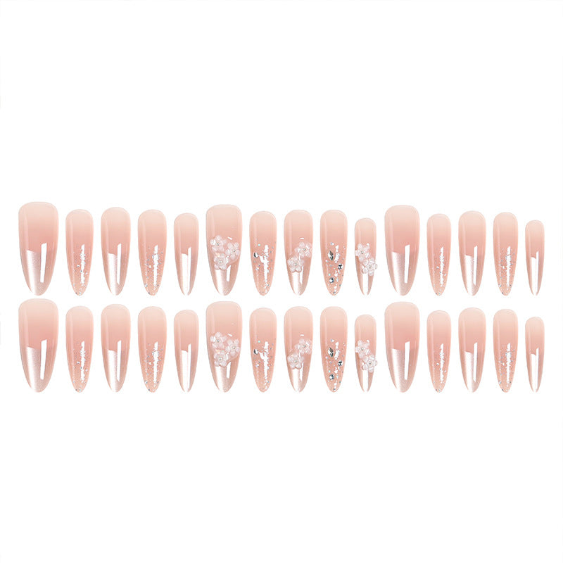 Kunstnagelset mit floralen 3D-Applikationen und Glitzerakzenten Brehn