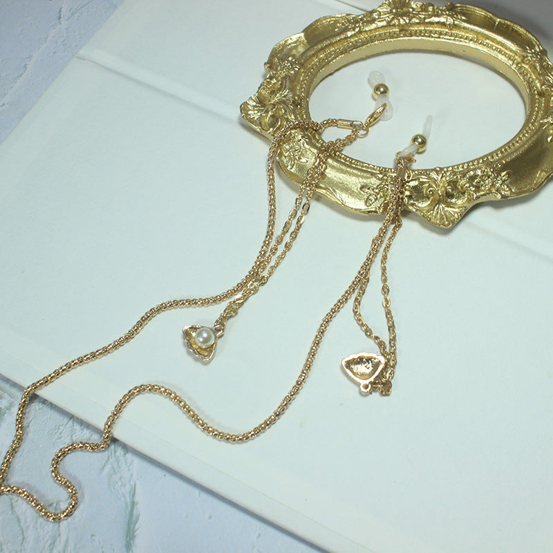 Elegante Kette mit Grünem Stein und Goldenen Akzenten Brehn