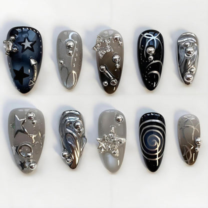Kunstnageldesign Set mit glamourösen Sternen- und Metallic-Akzenten Brehn