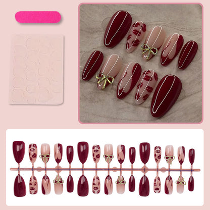 Kunstnagelset mit eleganten Schleifen- und Kussmund-Designs Brehn