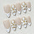 Kunstnagelset mit eleganten Blüten und Glitzerverzierungen Brehn