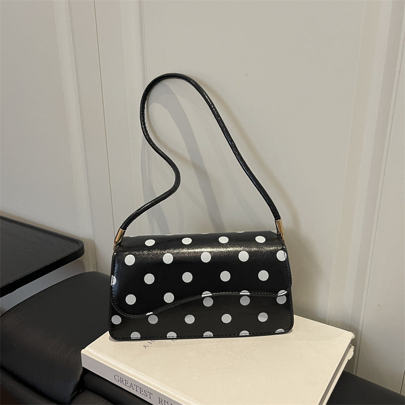 Schicke gepunktete Schultertasche