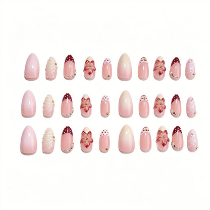 Kunstnagelset mit floralen Details und Glitzerakzenten Brehn