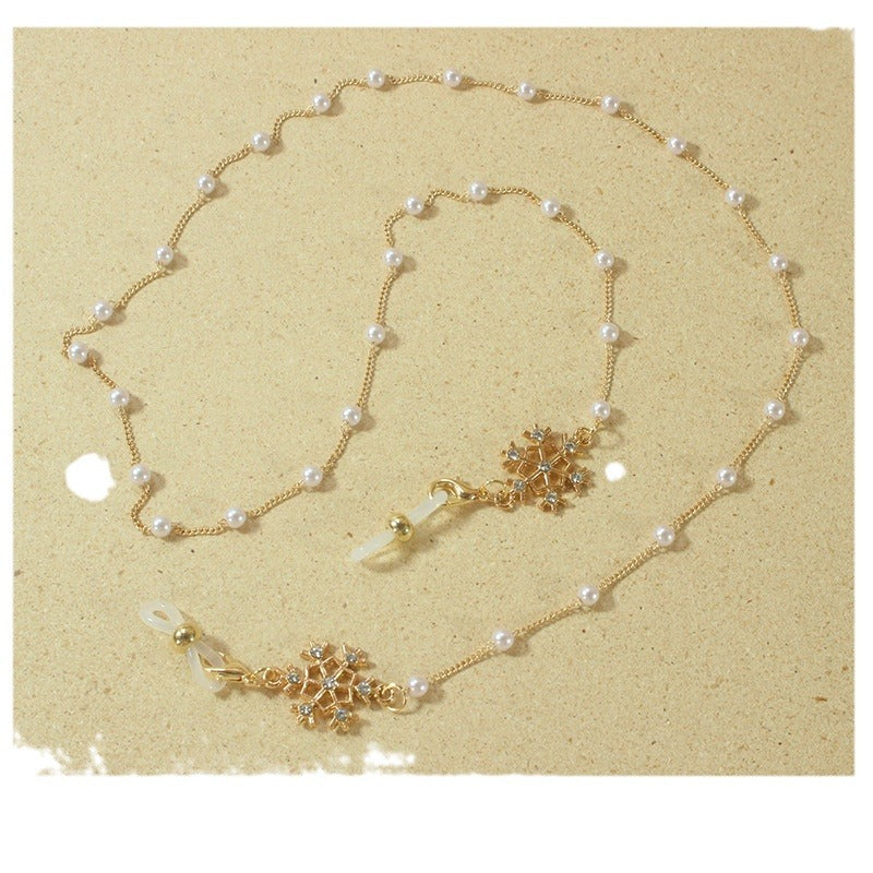 Elegante Brillenhalterkette mit Perlen und Schneeflockenanhänger Brehn