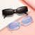 Damen stilvolle Sonnenbrille mit quadratischen Gläsern und transparentem Rahmen Brehn