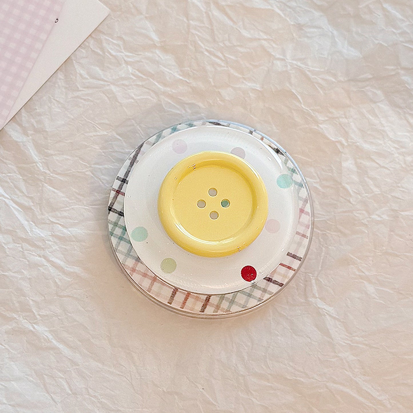 Dekorativer Untersetzer im Button-Design Brehn