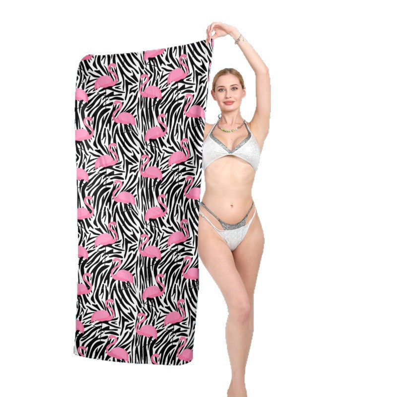 Strandtuch mit lebhaftem Flamingo-Muster und geometrischem Design Brehn
