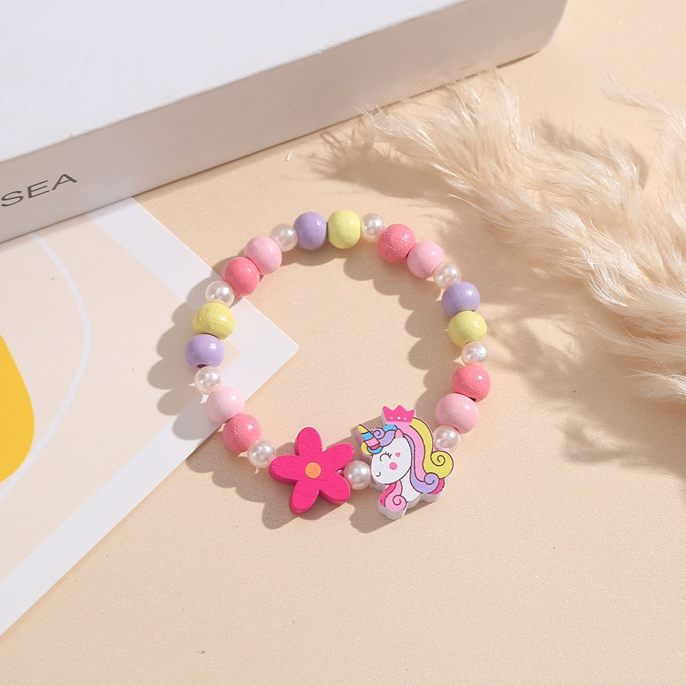 Verspieltes Kinderarmband mit Einhorn- und Blumenmotiv Brehn