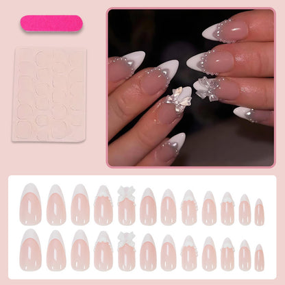 Kunstnagelset mit eleganten Spitzen und verspielten Schleifendetails Brehn
