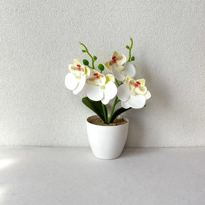 Elegante synthetische Orchideenarrangement