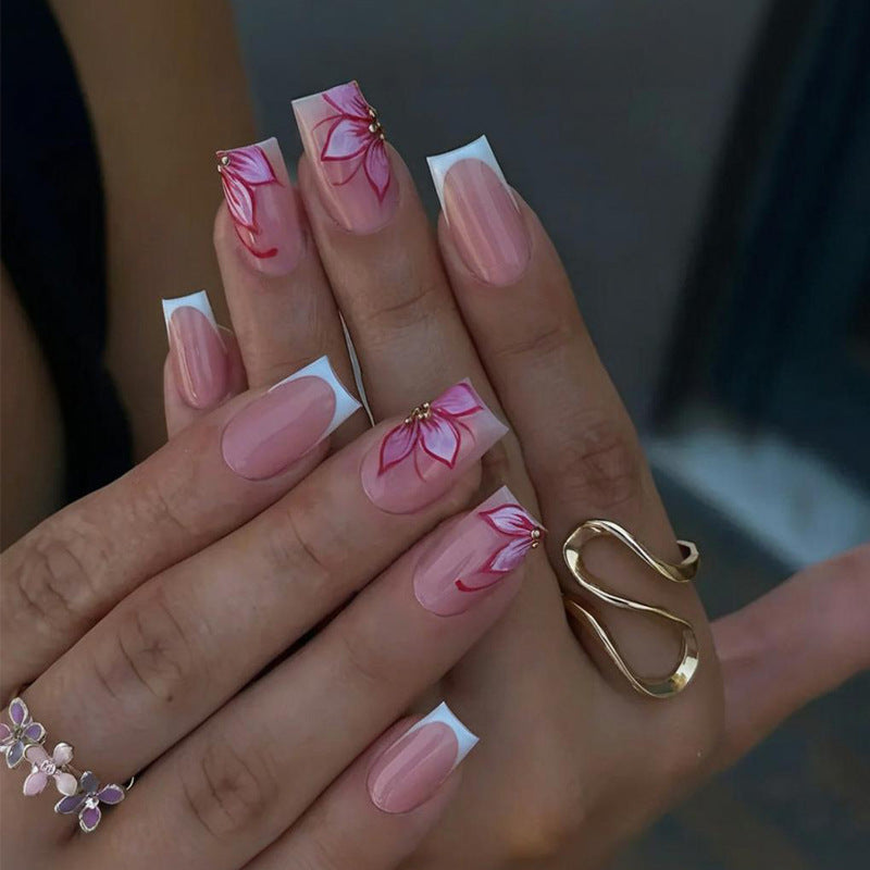 Kunstnagelset mit eleganten Blumen-Designs und Glitzerakzenten Brehn