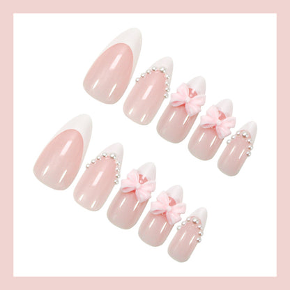 Kunstnagelset mit eleganten Schleifen- und Perlenverzierungen Brehn