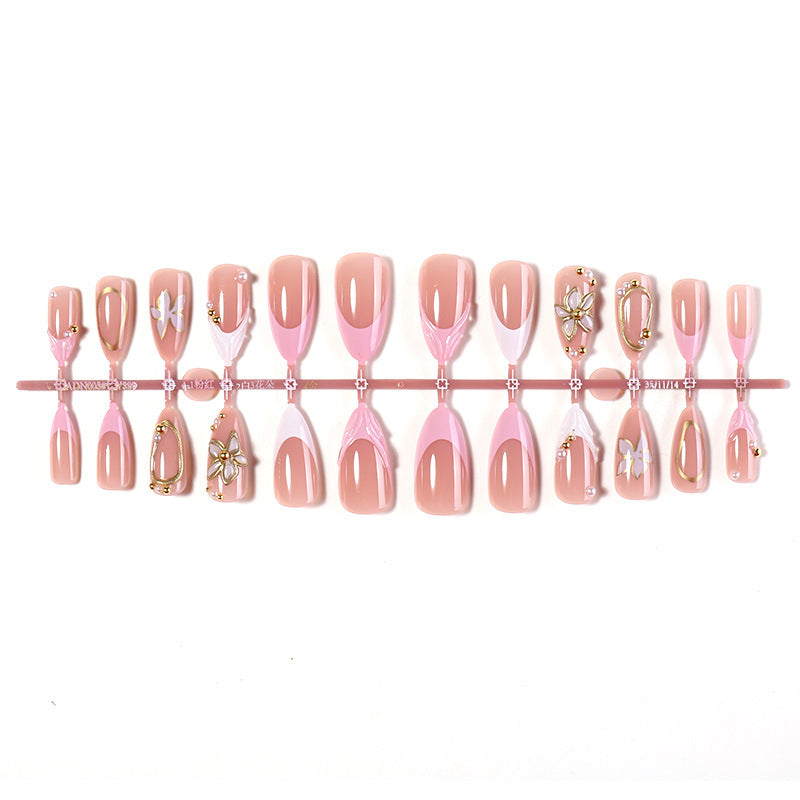 Dekorativer Press-On Nagelset mit floralen Designs Brehn