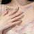 Künstlerisches Press-On Nagelset mit Schmetterlings- und Blumendesigns Brehn