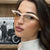 Damen futuristische Sonnenbrille mit geschwungenem Rahmen und polarisierenden Gläsern Brehn
