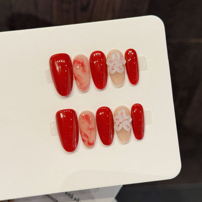 Künstlerische Press-On-Nagelkunst-Set mit floralem und glänzendem Design