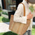 Elegante Bast-Handtasche mit Lederakzenten Brehn