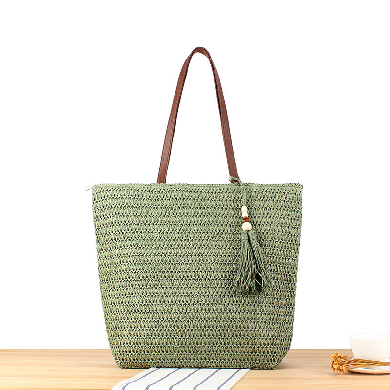 Handtasche Aus Geflochtenem Naturmaterial mit Quastenverzierung Brehn