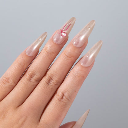 Elegantes Stiletto Press-On Nagelset mit Schleifenakzenten Brehn