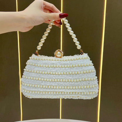 Elegante perlenverzierte Handtasche