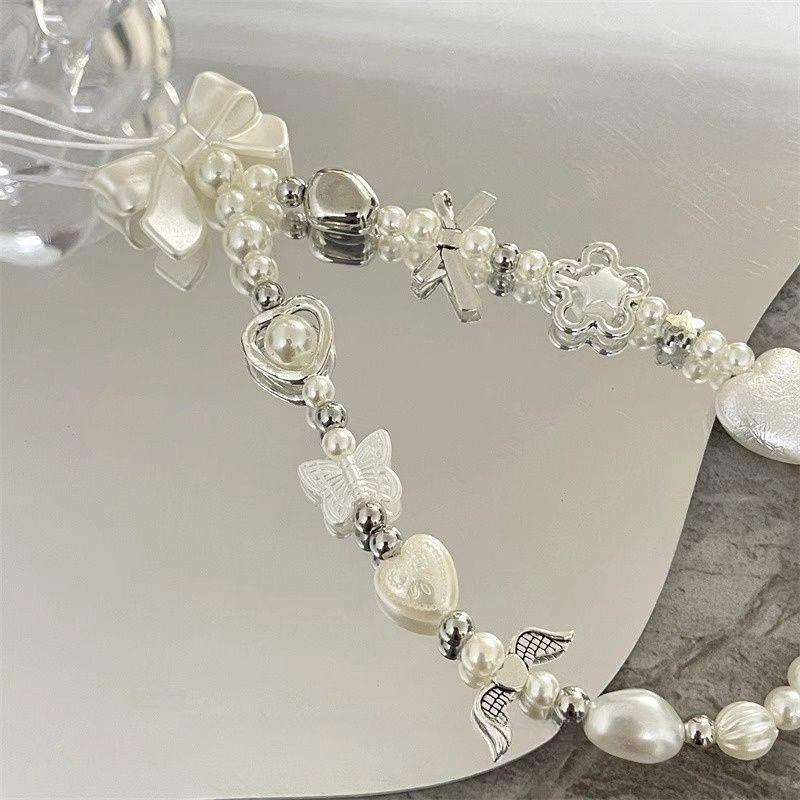 Herz und Schmetterling Charm Perlenarmband Brehn