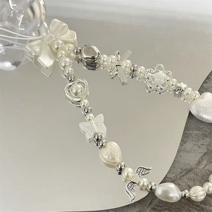 Herz und Schmetterling Charm Perlenarmband Brehn