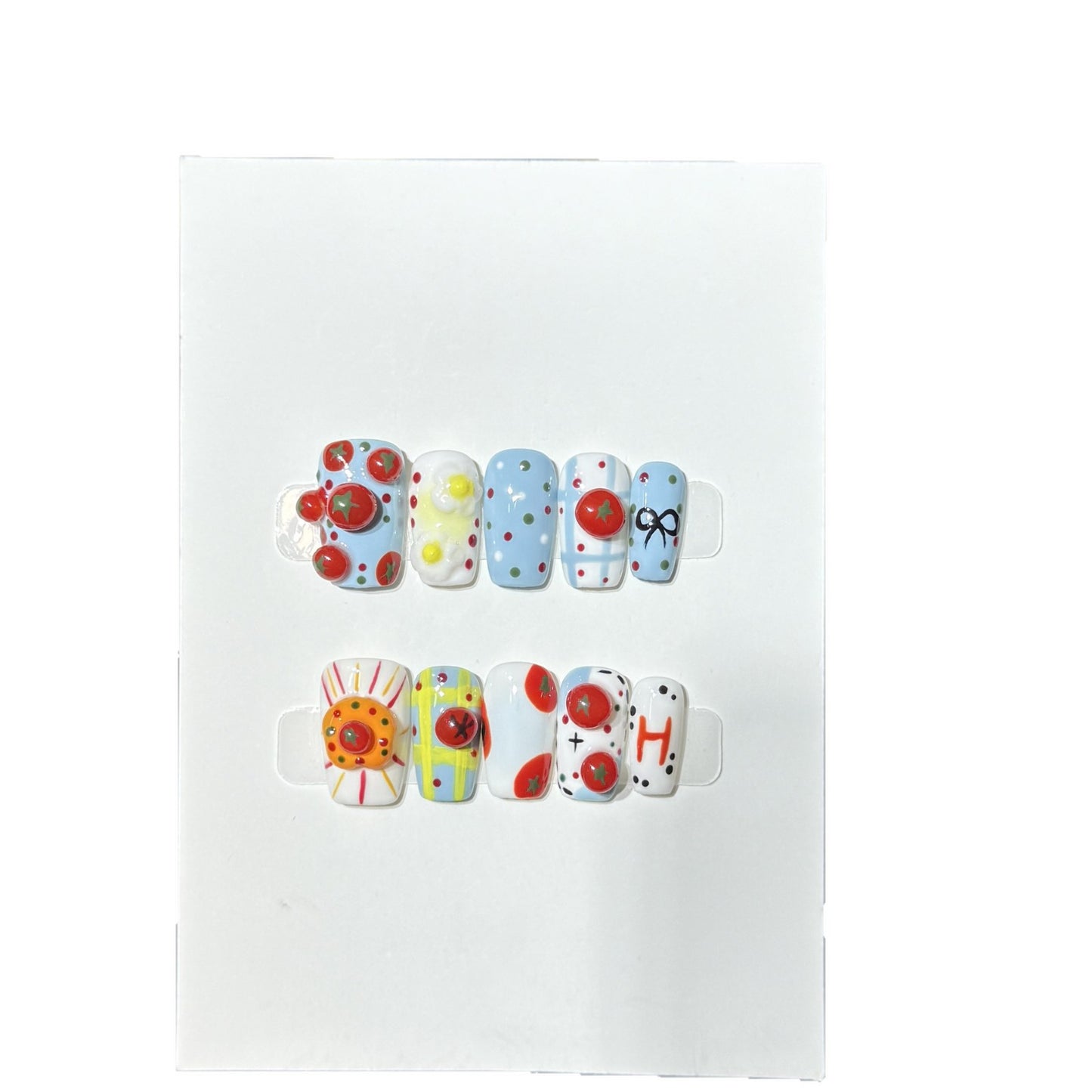 Künstlerisches Press-On-Nagelset mit verspielten floralen und gepunkteten Designs Brehn
