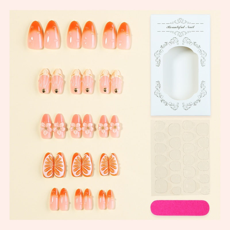 Kreatives Nagelset mit Blumen- und Fruchtverzierungen Brehn