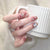 Kunstnagelset mit eleganten Glitzer- und Sternverzierungen Brehn
