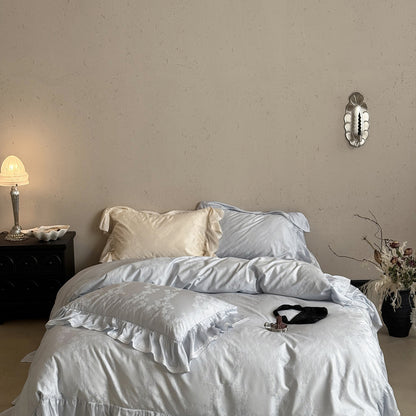 Luxuriöses Baumwollsatin-Bettwäsche-Set mit Rüschensaum