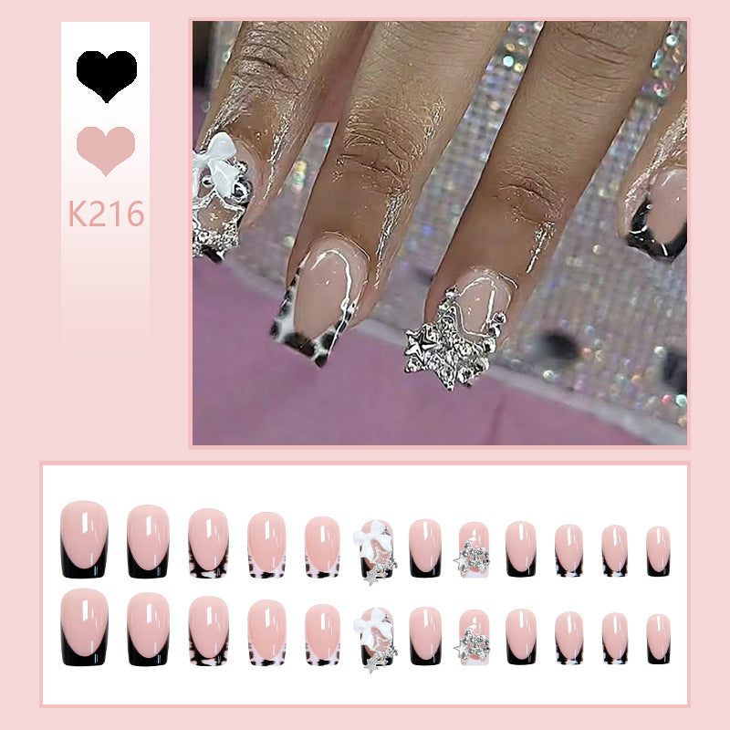 Kunstnagelset mit glamourösen Starlights und eleganten Verzierungen Brehn