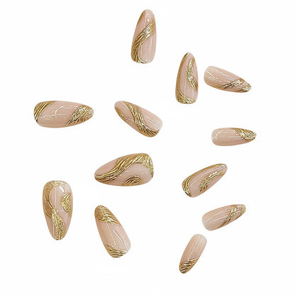 Künstlerisches Press-On Nagelset mit goldener Wirbel-Design Brehn