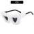Stylische Sonnenbrille mit dreieckigem Rahmen und Kunstfellbesatz