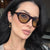 Damen modische Sonnenbrille mit geschwungenem Rahmen und schützendem UV-Filter Brehn