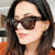 Damen stylische Sonnenbrille im modernen Design mit transparentem Rahmen Brehn