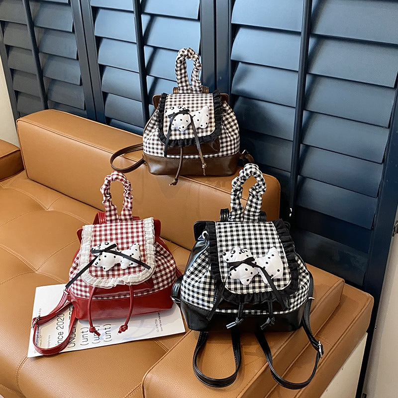 Verspielter Rucksack mit Karomuster und Tierapplikation Brehn