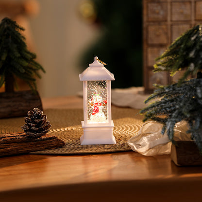 Beleuchtete Weihnachtslaterne mit glitzerndem Schneemann-Szenario Brehn