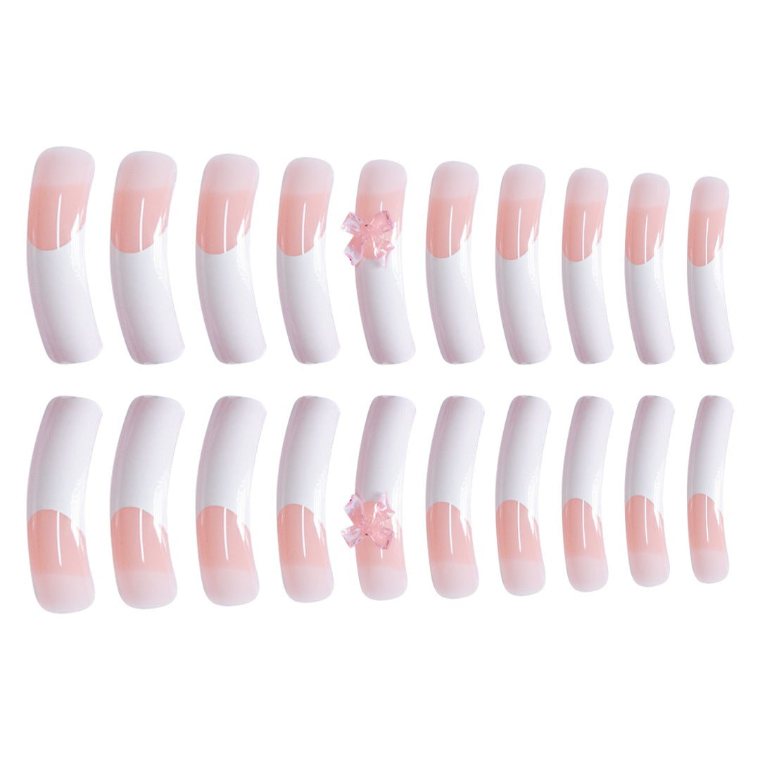 Stylische Acryl Press-On Nagelverlängerungen mit dekorativem Bogen Brehn